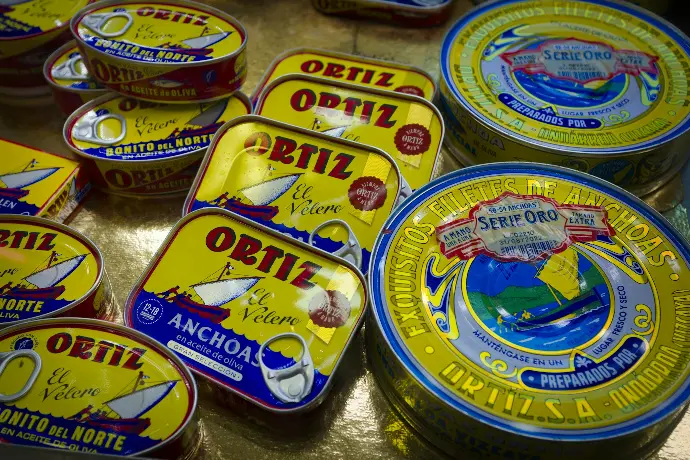 a group of tins of food sitting on top of a table